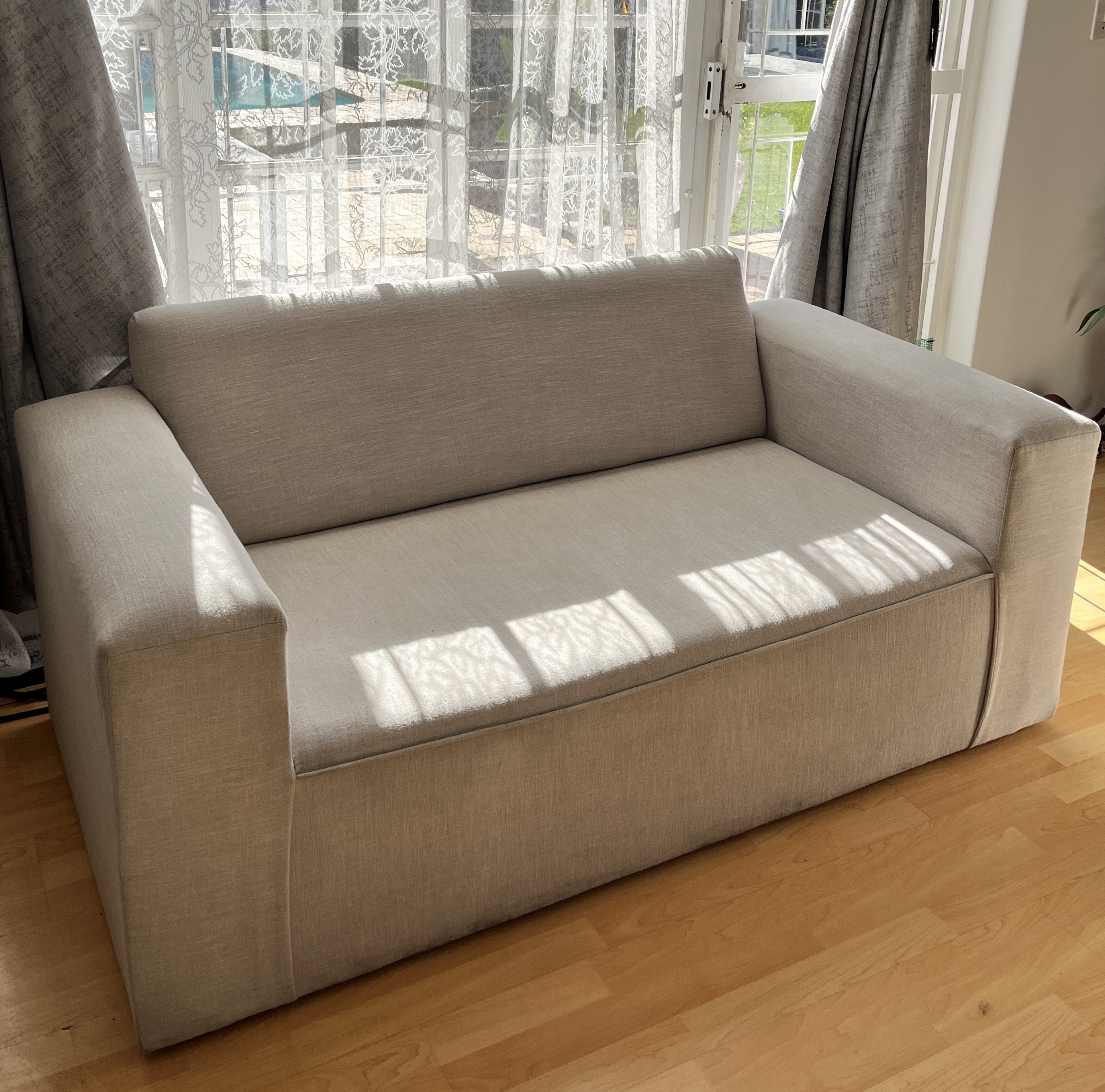 Two-seater fabric couch after cleaning